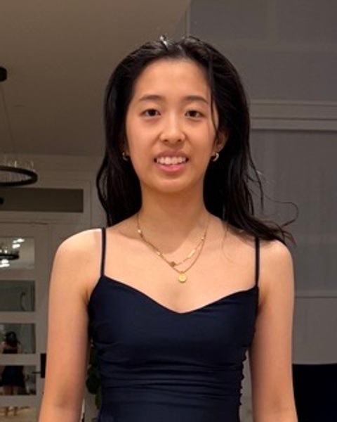 Katelyn, wearing a navy dress